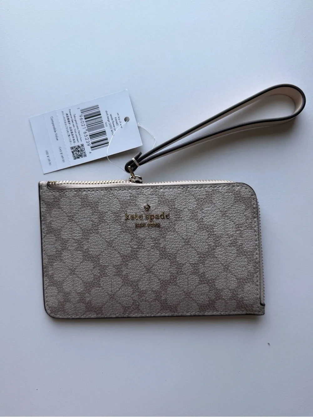 kate spade beige patterned wristlet card case with gold logo